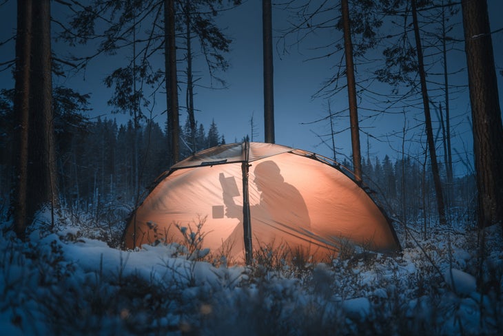 man sleeps in tent