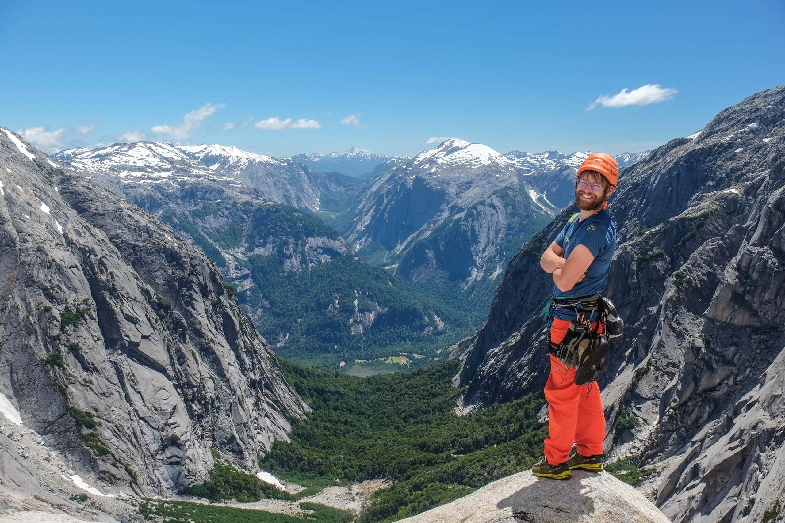 The author in his happy place, high up on the Escudo wall in Cochamós Anfiteatro, looking down into La Junta Valley.