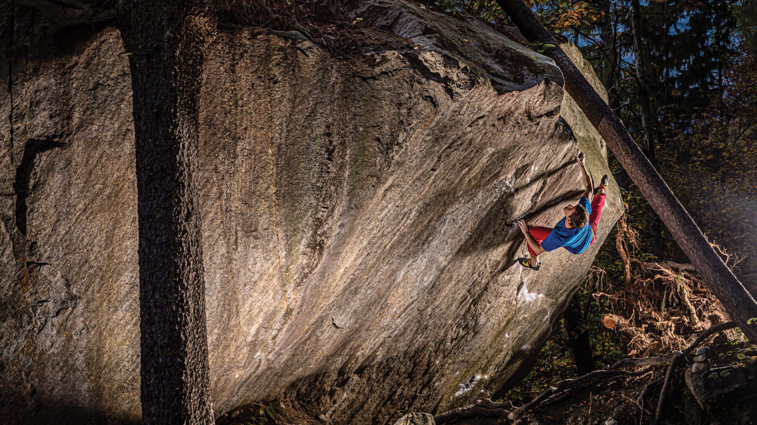 Martin Keller surfing the final rail of Dreamtime (V15), Cresciano, Switzerland. Dreamtime was the first of its grade, ever.
