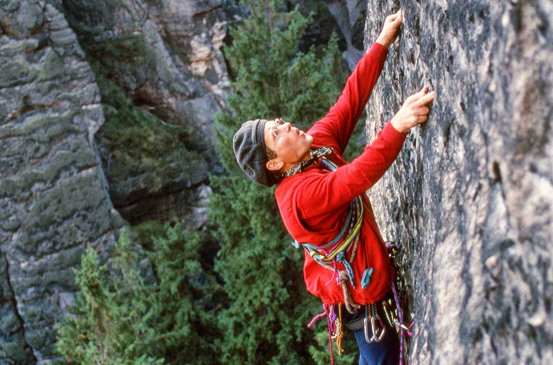 Elbsandstein master of sport Bernd Arnold, on a first ascent, onsight, no chalk, with jammed knots for pro. Arnold was prolific in the Dresden area, putting up many of its most difficult routes in the 1970s.