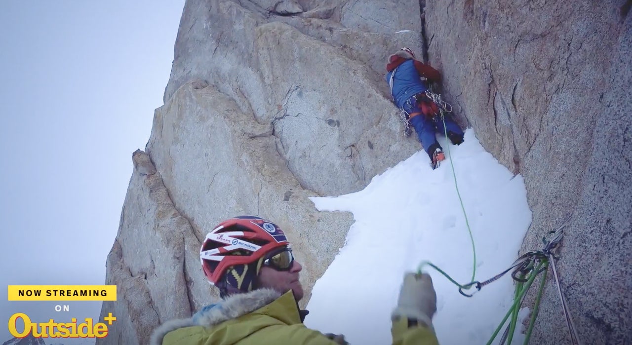 Climber attempts a granite crack in Antarctica.