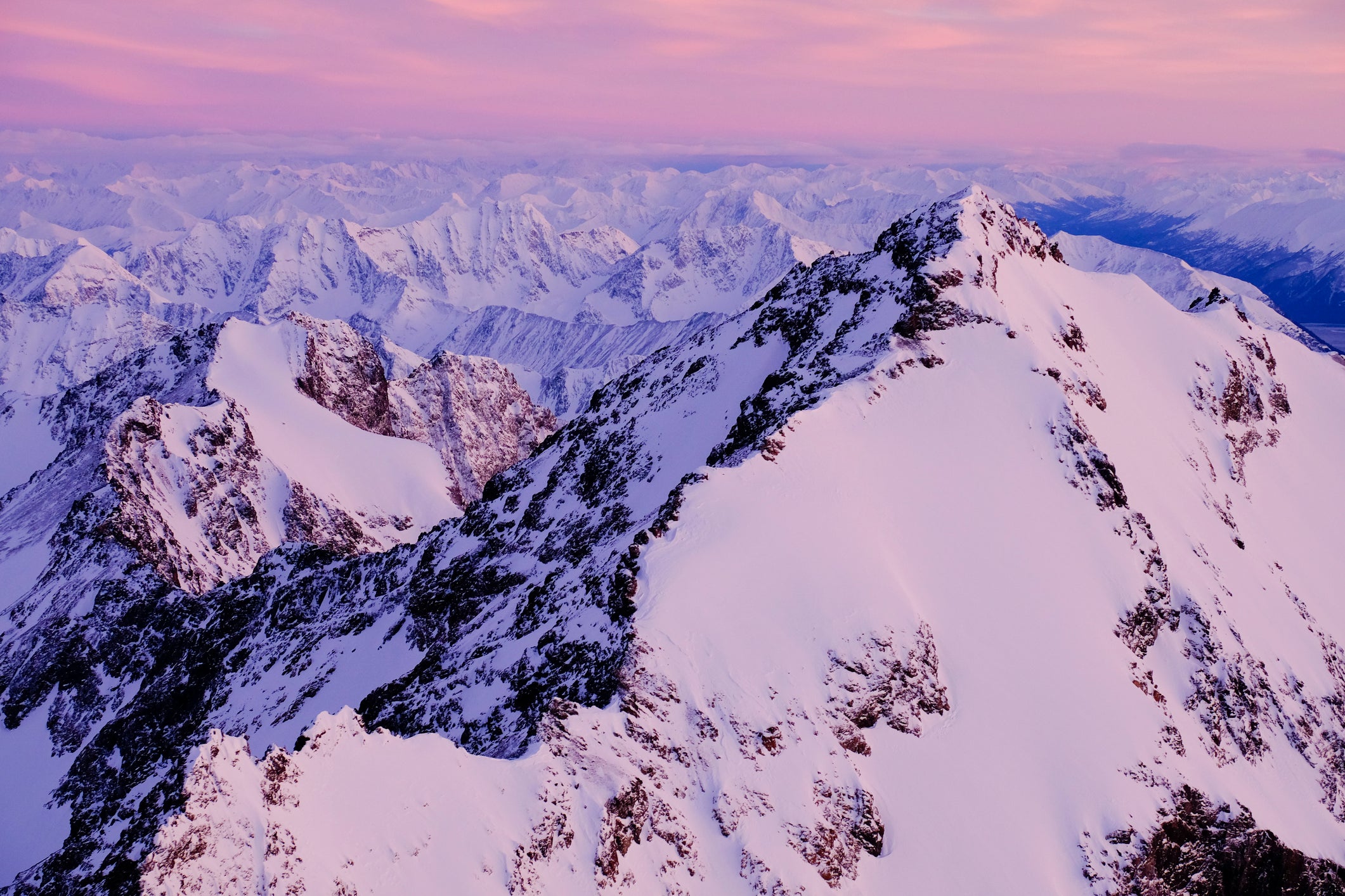 Aerial view of sunset light over Eagle Peak and the mountain of Chugach range, Alaska.