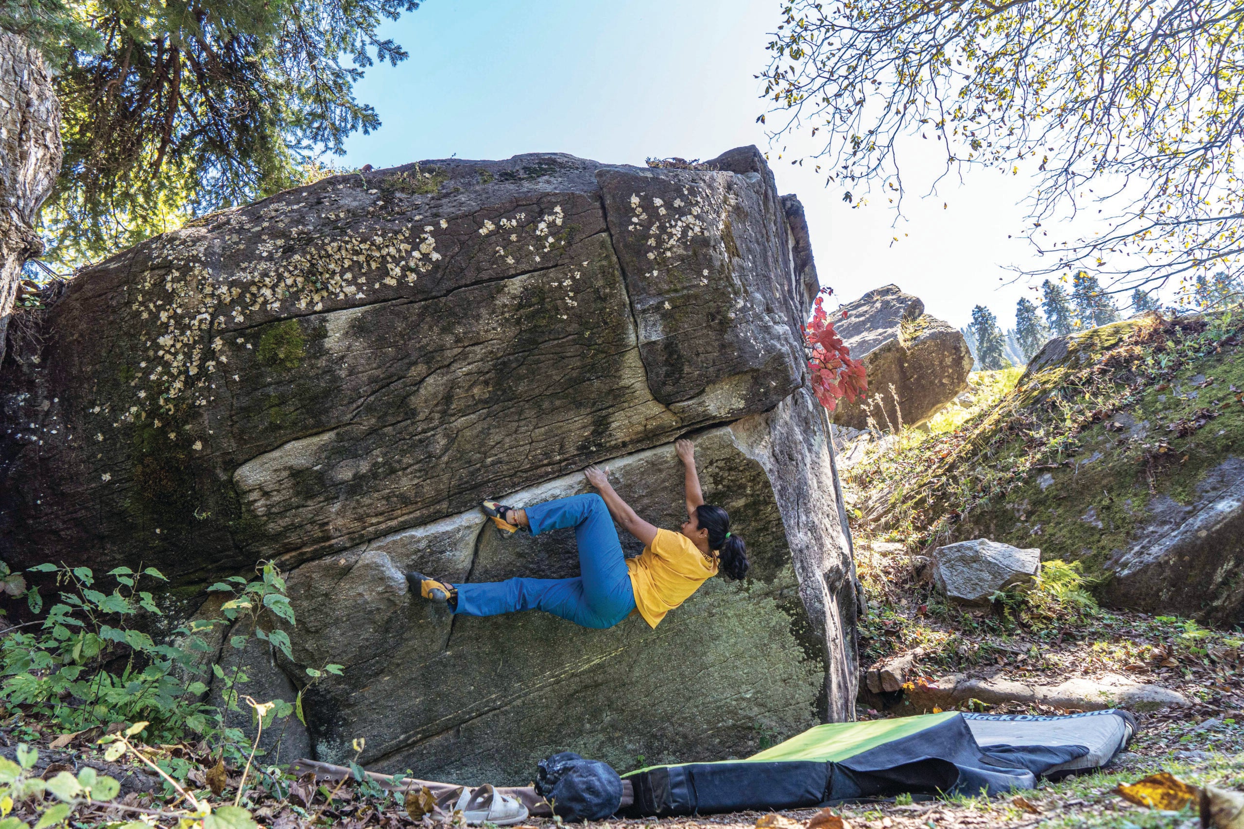 The author working Bleeder (6b+/V4) during the 2021 Climb Like A Woman event in Sethan, India. “Wide shoulders, bulky legs, no clean abs, and not-tall—I’ve always struggled in accepting my body image. However, I found enough strength from the women around me to accept myself,” she says.