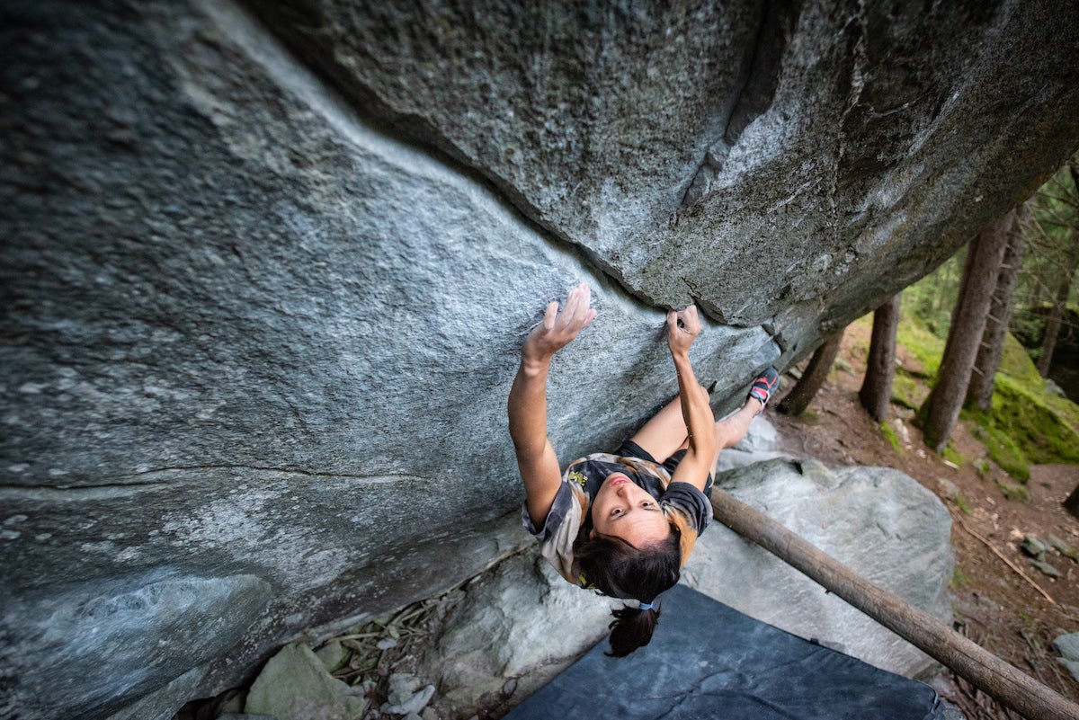 Katie Lamb on Bernd Zangerl's classic New Base Line (V14), in Magic Wood, Switzerland.