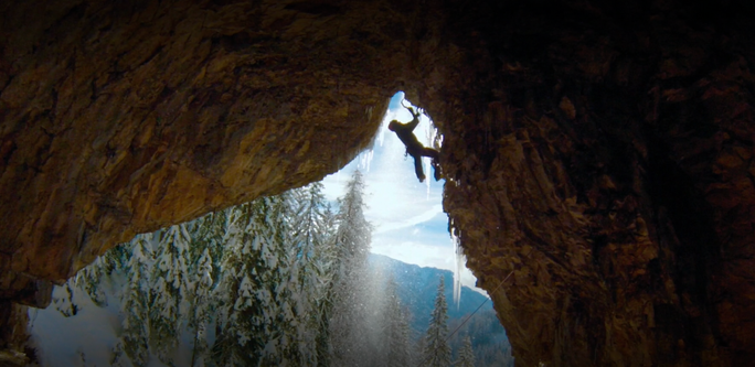 Tom climbing a mixed line