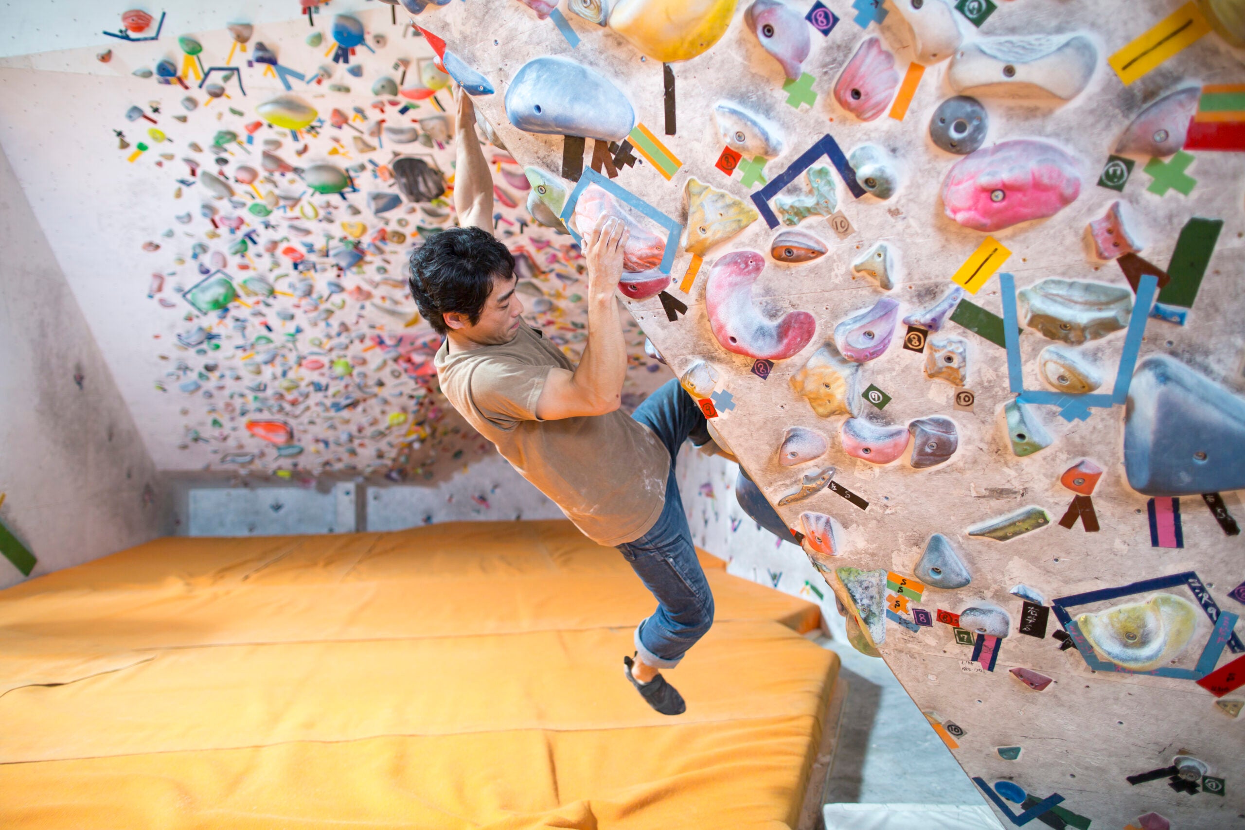A bouldering wall is typically 12 to 15 feet tall, and it mimics most boulders you’d encounter if climbing outside, although some “highball” outdoor boulders may be much taller.
