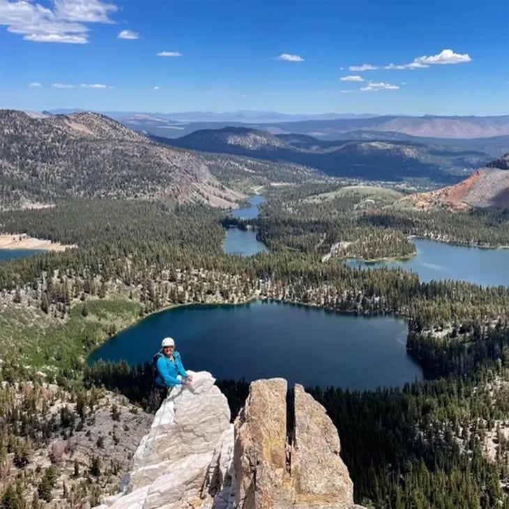 Thiele on a rocky summit overlooking lakes