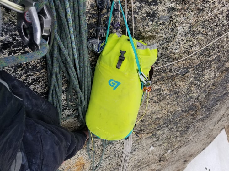The G7 Haul Pack clipped to a rock anchor.