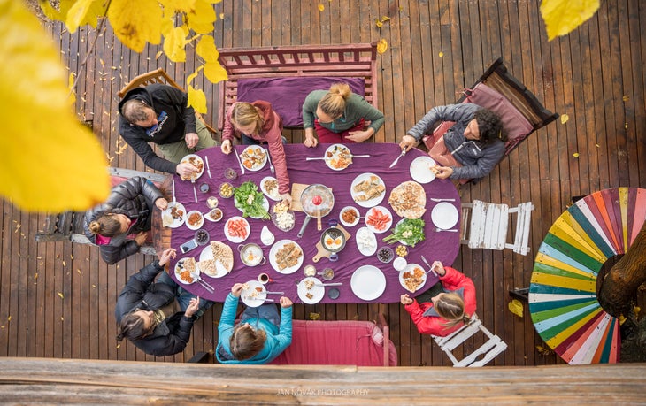 Rock Climbers eating at a table.