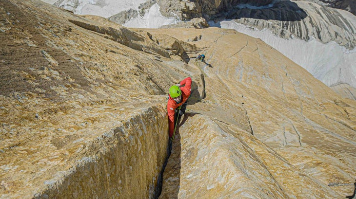 Jacopo Larcher climbs steep hand crack in Pakistan.