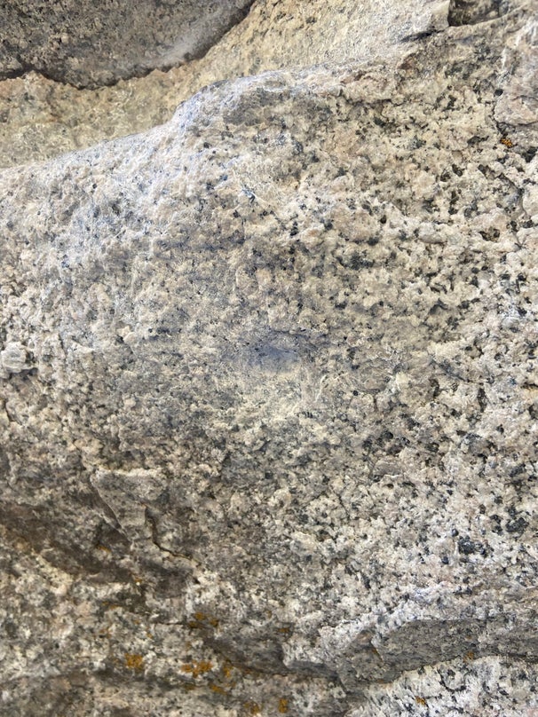 Chipped handle on boulder in Utah.