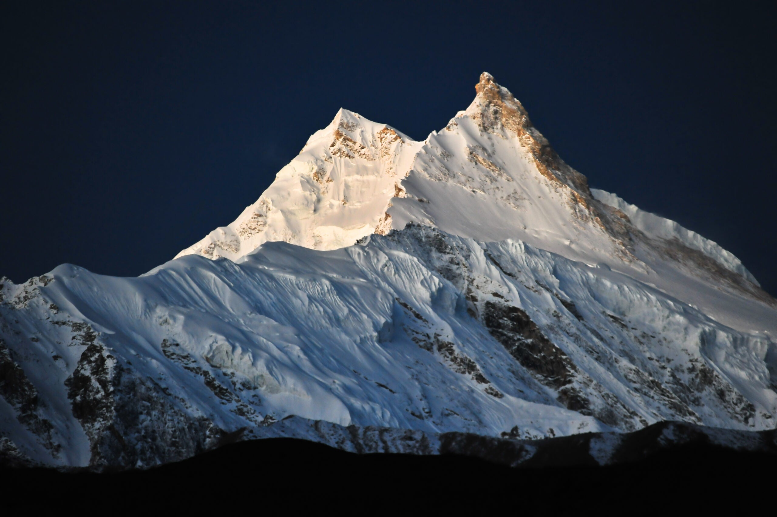 Pre-dawn view of the double peaked summit of Manaslu, the eighth highest mountain in the world at 8156m.