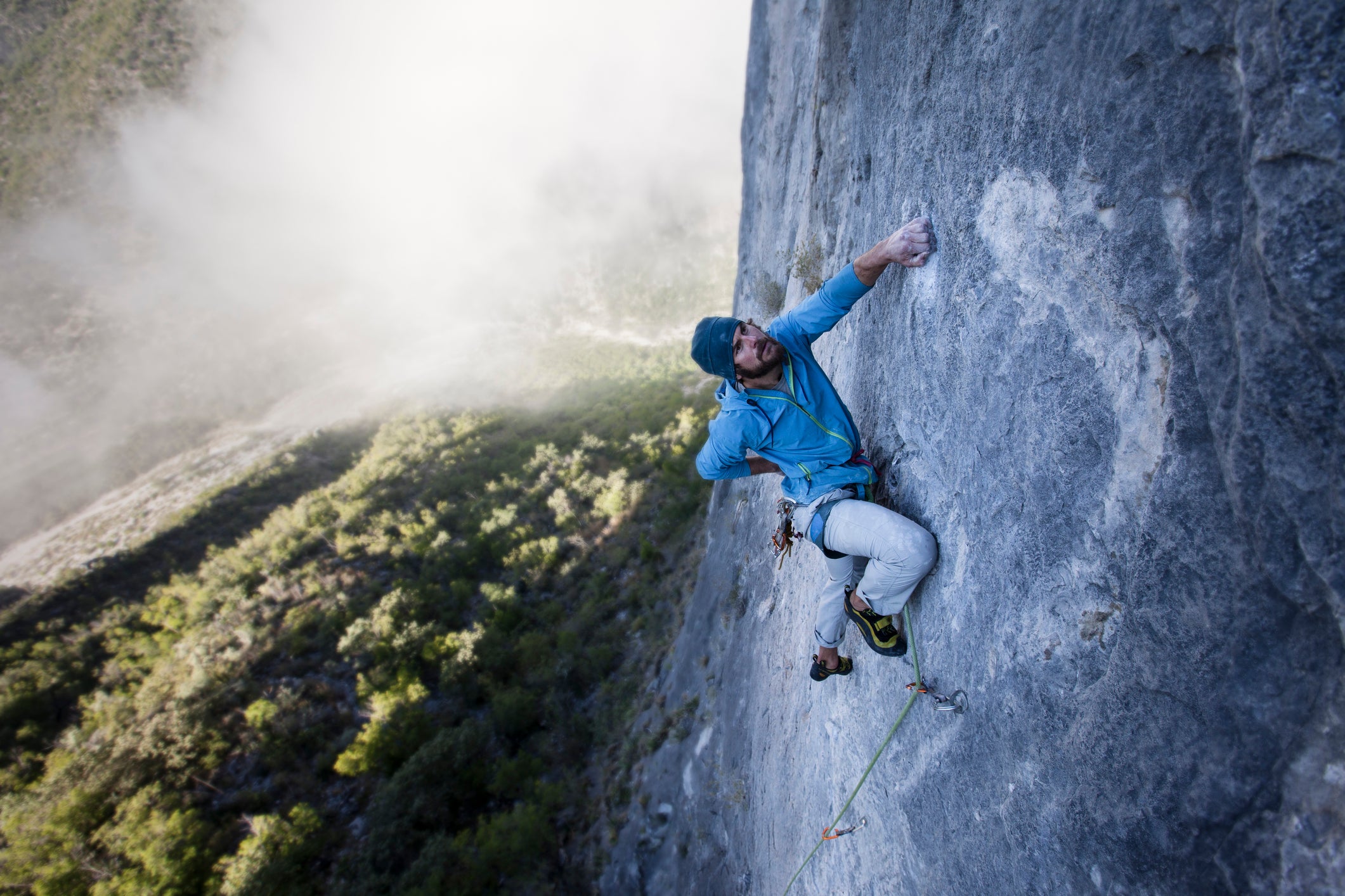 Rock climber chalking in Potrero Chico, Mexico.