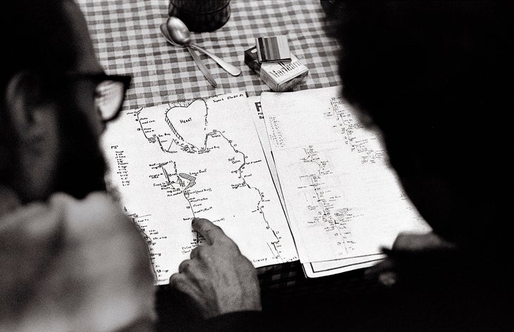 Royal Robbins reading climbing topo in Yosemite.