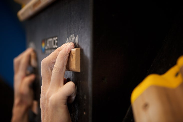 Finger position on climbing hangboard.