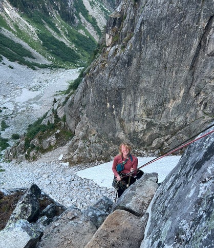 Cassy Doolittle rappels down steep granite face.