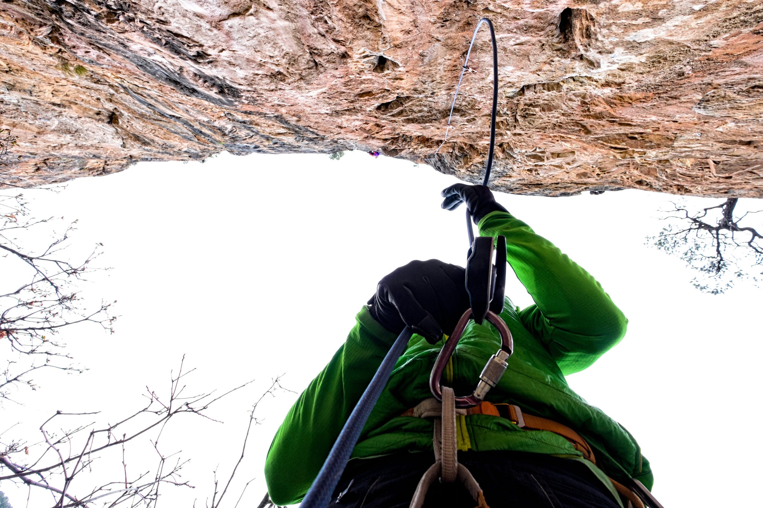 Rock Climbing in Scenic Canyon - Belaying climber on sport route.