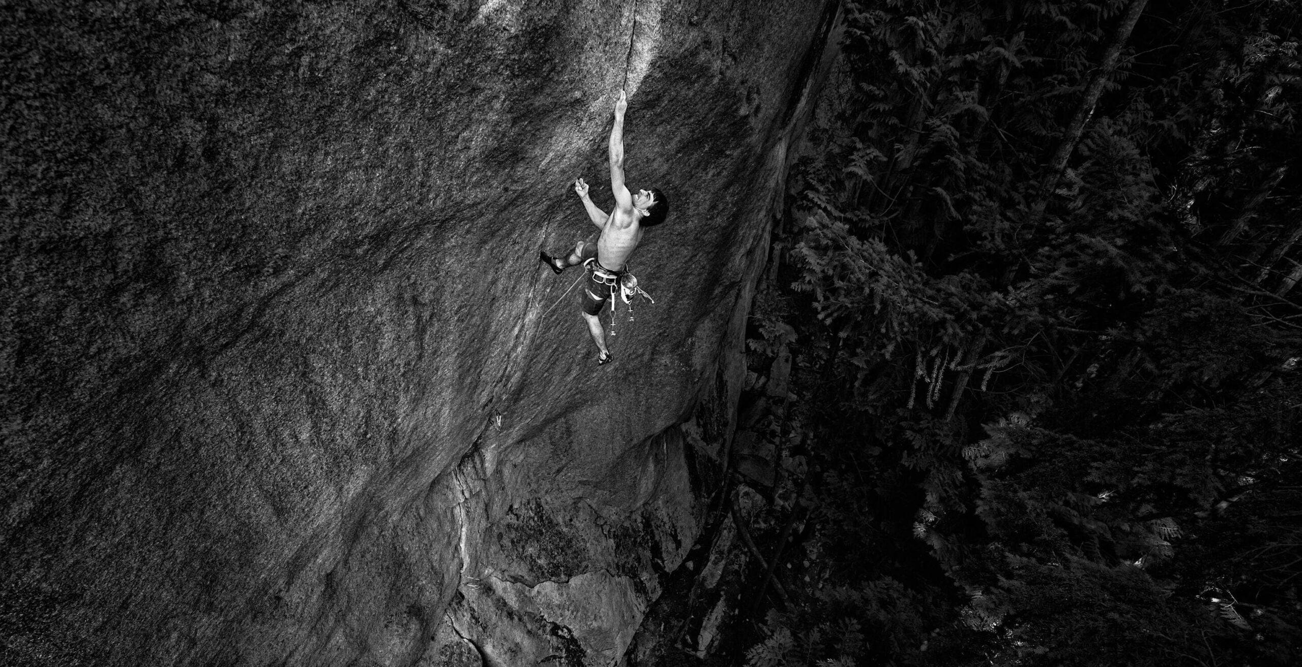 Man climbs finger crack in Squamish.