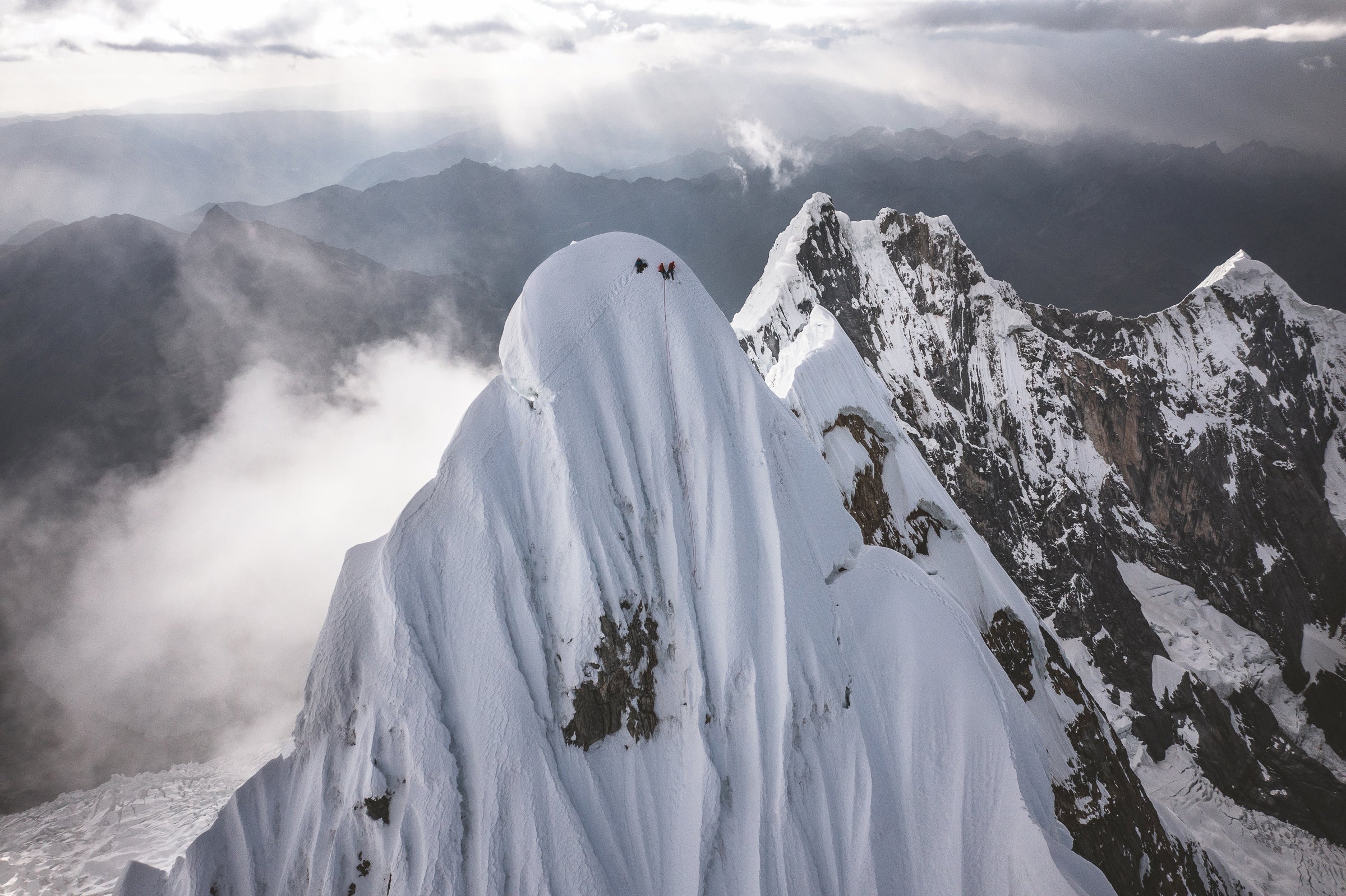 josh wharton, vince anderson on the summit of jirishanca, peru. Alik Berg and his partner Quentin Roberts arrived within minutes of josh and vince after climbing a different difficult new line.