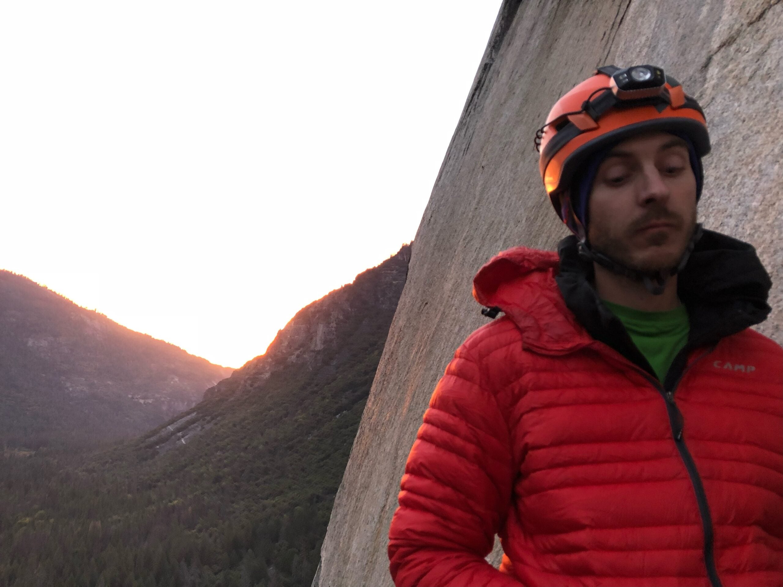 A climber looking beat up on the Nose