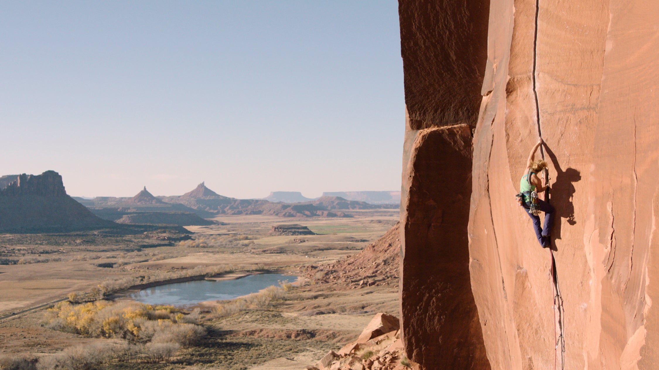 a climber climbing a crack in indian creek in bears ears national monument