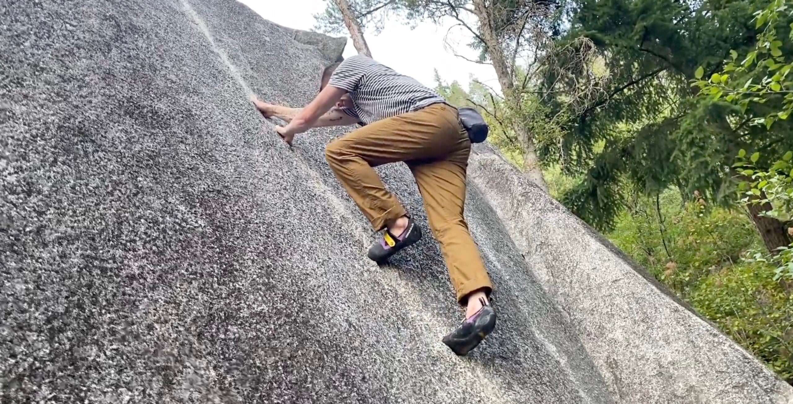 Nat Bailey bouldering in Rab Radius Pants