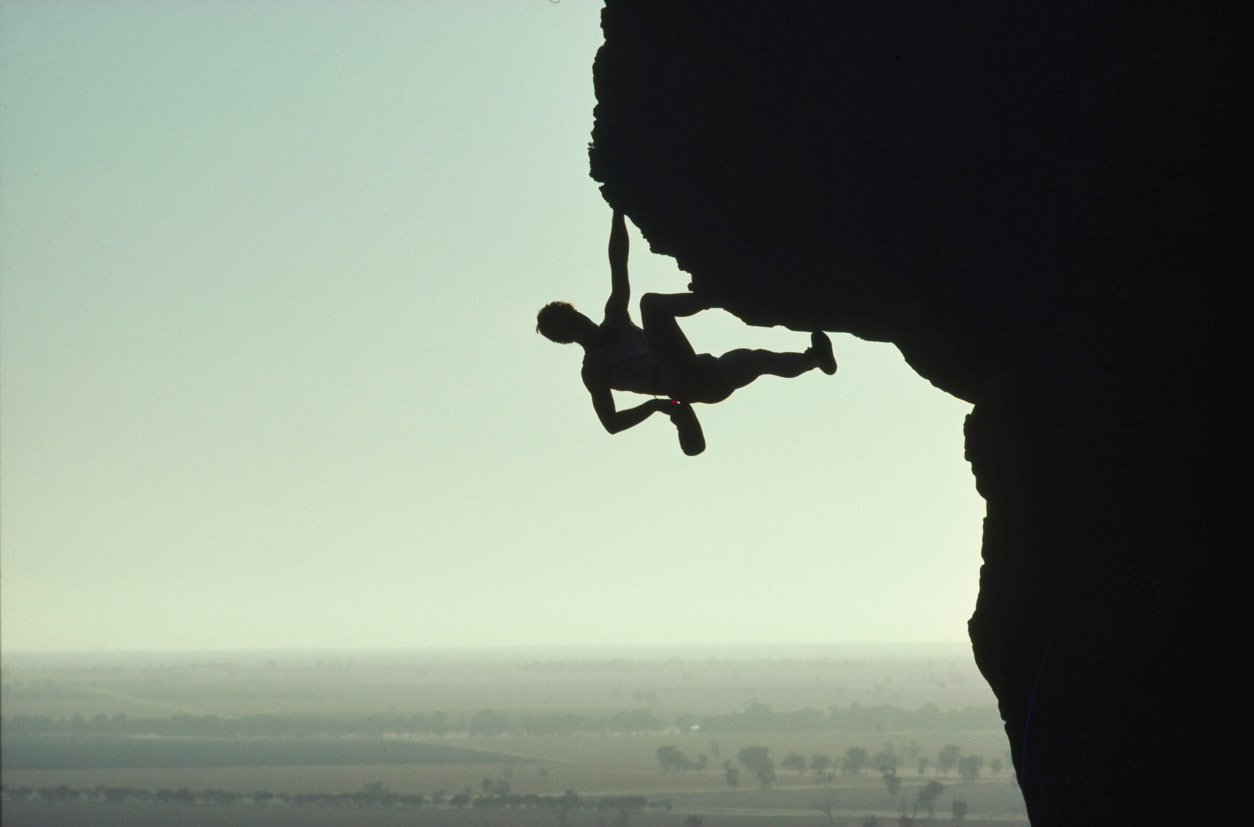 a climber free soloing in Mount Arapiles, Australia