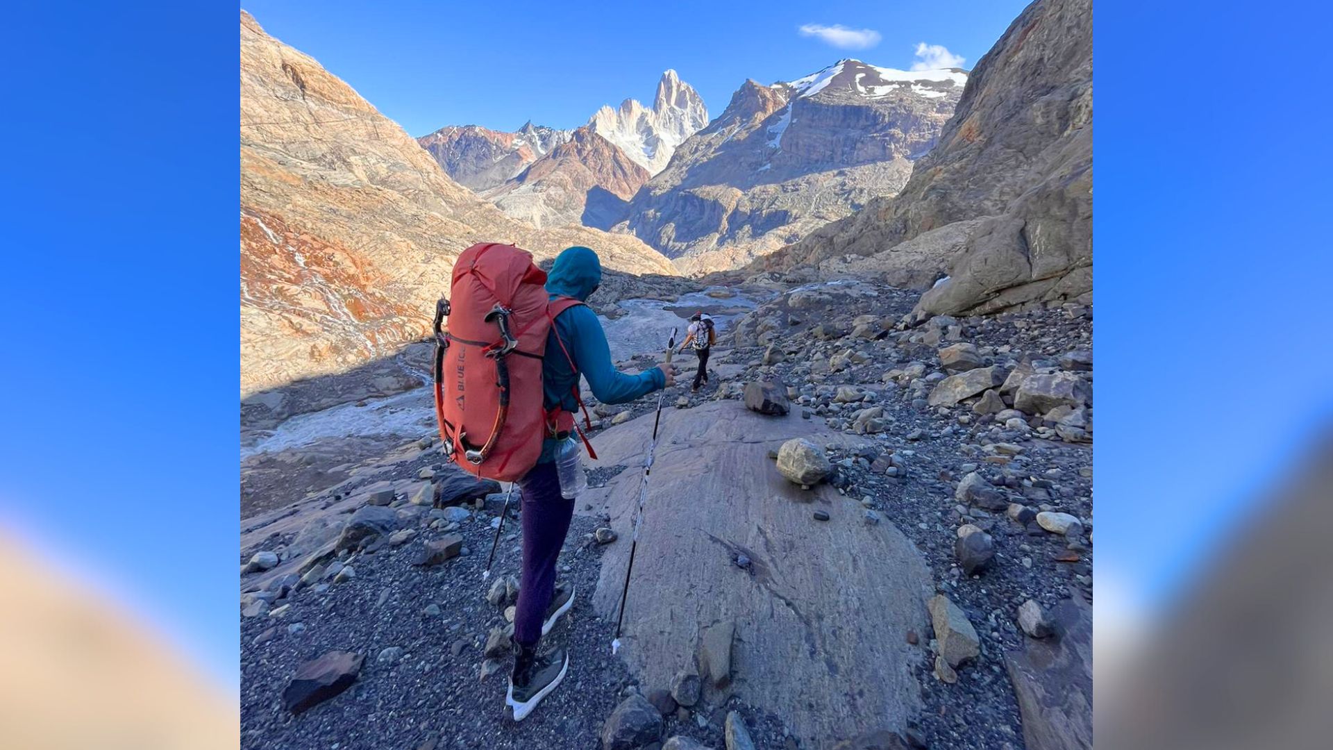 Hiking back to town after an attempt of Cerro Torre, in Argentine Patagonia. The climber uses Leki poles to avoid the hidden danger of trekking poles.